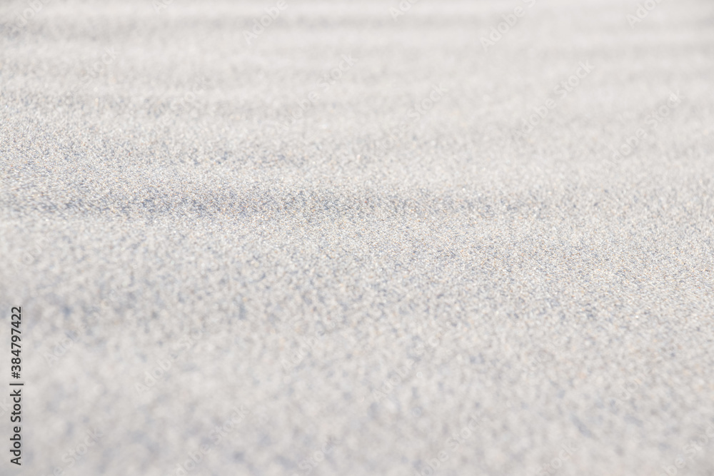 Background with selective focus and sand. Selective focus of light sand on the beach. Background of the sand. Europe. Close-up. Copy space. Background with selective focus and sand. Selective focus of light sand on the beach. Background of the sand. Europe. Close-up. Copy space.