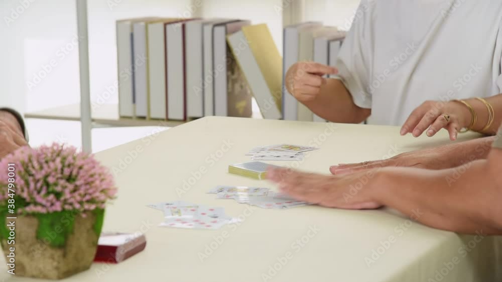 Group of senior elderly asian people in casual outfit reunion meeting with old friend playing card together with happy and smile emotion Group of senior elderly asian people in casual outfit reunion meeting with old friend playing card together with happy and smile emotion