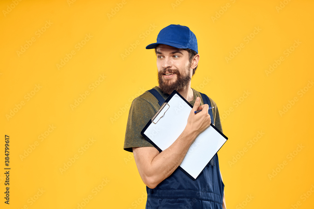 Man in working form documents transportation delivery service yellow background Man in working form documents transportation delivery service yellow background