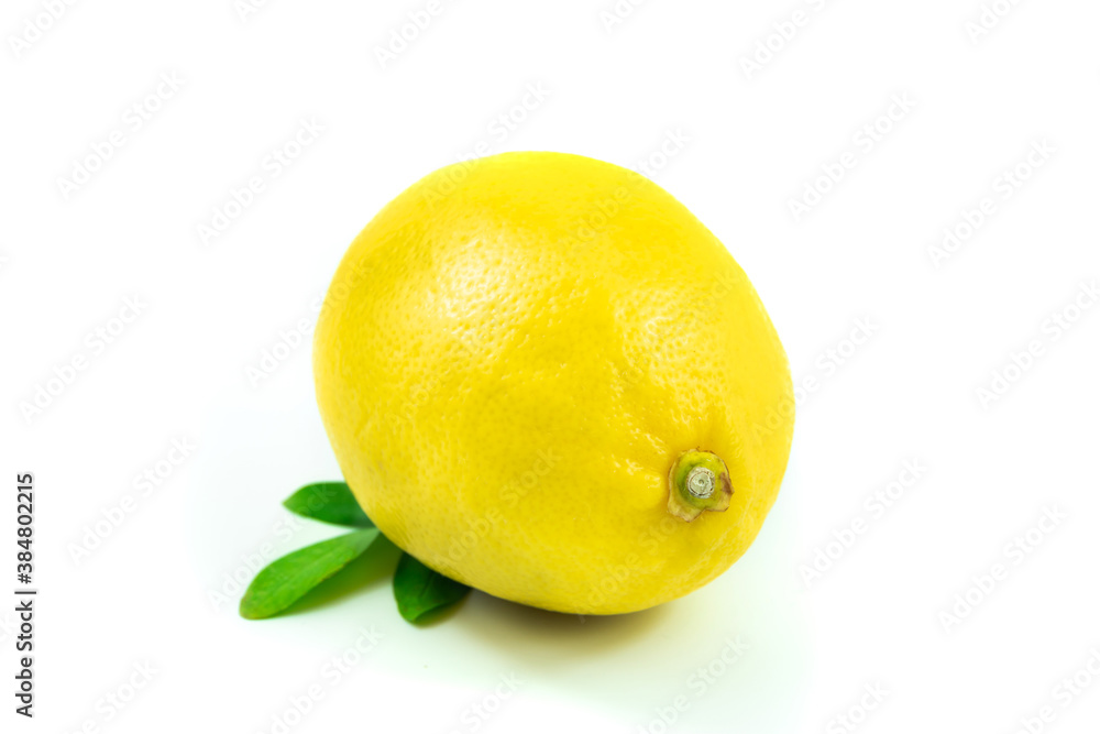 Whole perfect lemon with green leaves on white isolated background Whole perfect lemon with green leaves on white isolated background