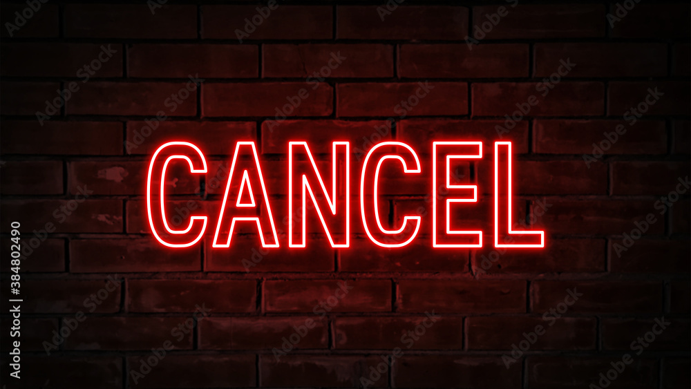 Obraz premium Cancel - red neon light word on brick wall background