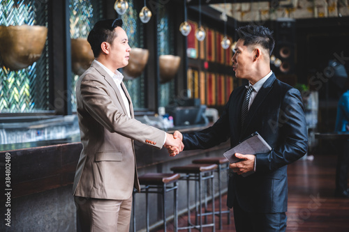 business people hands shake...