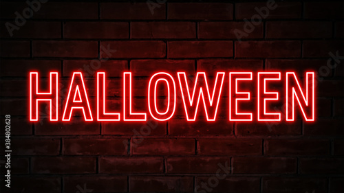Halloween - red neon light word on brick wall background