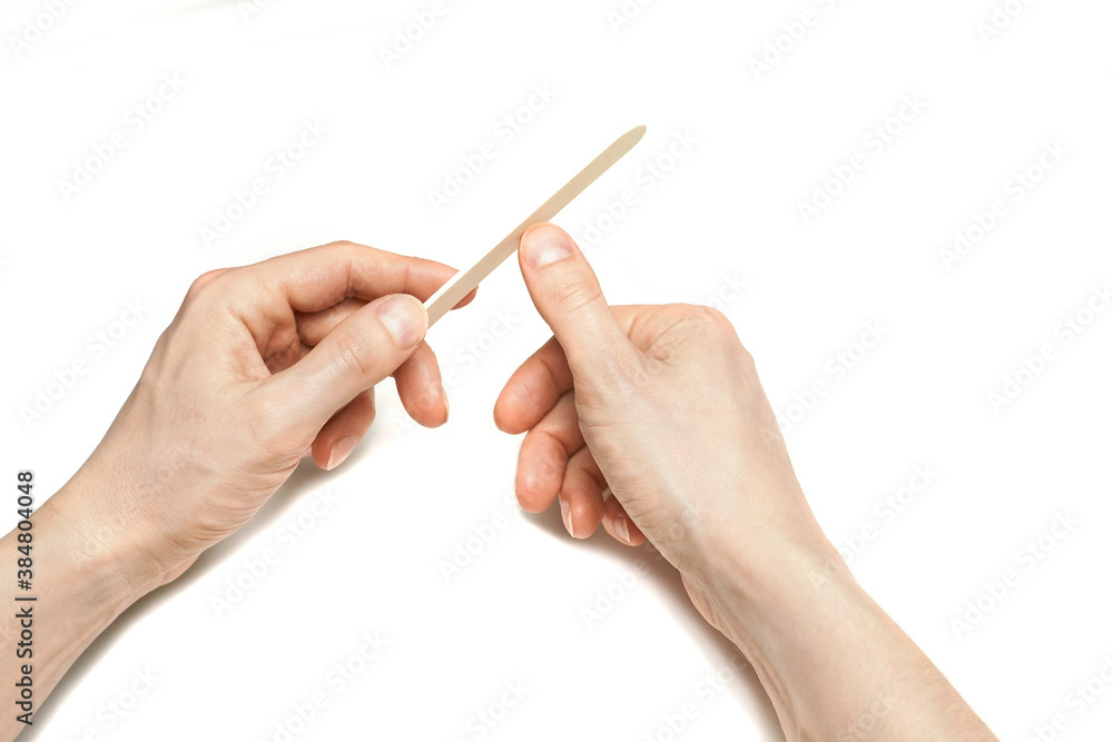 Man do manicure at home. Self hand routine. Copy space for text. Male finger procedure. White background isolated. Copyspace. Thumb fingernail clean. Man manicurist service. Horizontal Man do manicure at home. Self hand routine. Copy space for text. Male finger procedure. White background isolated. Copyspace. Thumb fingernail clean. Man manicurist service. Horizontal
