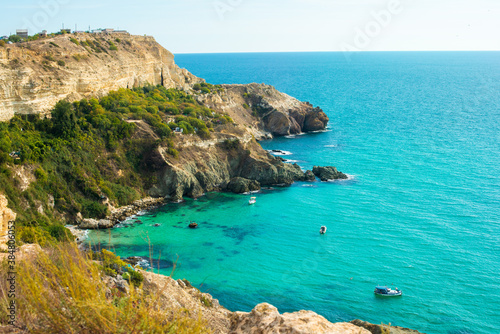 Cape Fiolent in summer in sunny weather. Crimea, Russia. A lot of boats and ships. mountains, sea. turquoise water color