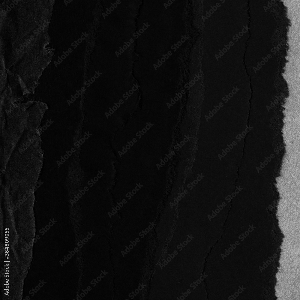 Black torn paper collage close-up. Texture made from various paper and cardboard parts. Damaged old paper background. Vintage blank wallpaper. Material design backdrop. Black torn paper collage close-up. Texture made from various paper and cardboard parts. Damaged old paper background. Vintage blank wallpaper. Material design backdrop.