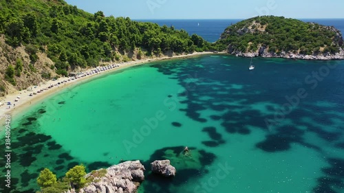 Aerial drone video of beautiful turquoise sandy beach of Stafilos, Skopleos island, Sporades, Greece  photo