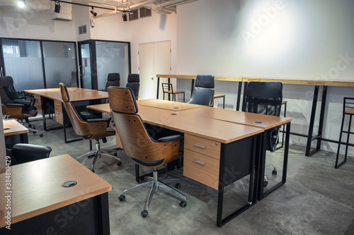 Interior of empty modern office and coworking space temporarily closed and policy for employees to work from home