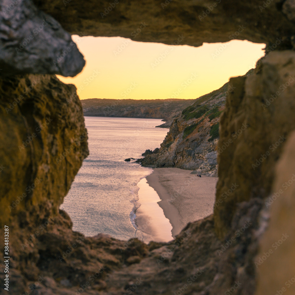Framed portuguese beach at sunset from high angle view Framed portuguese beach at sunset from high angle view