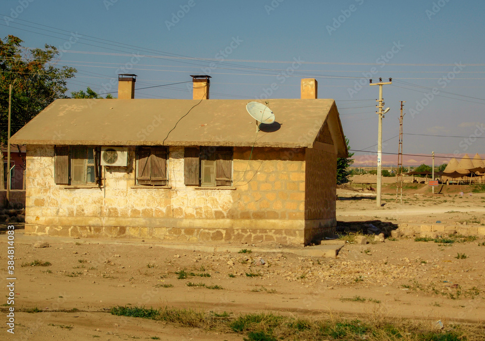 A mud public hut, a small single-story building of simple or crude construction, serving as a poor, rough, or temporary house or shelter in Eastern Anatolia, Harran. A mud public hut, a small single-story building of simple or crude construction, serving as a poor, rough, or temporary house or shelter in Eastern Anatolia, Harran.