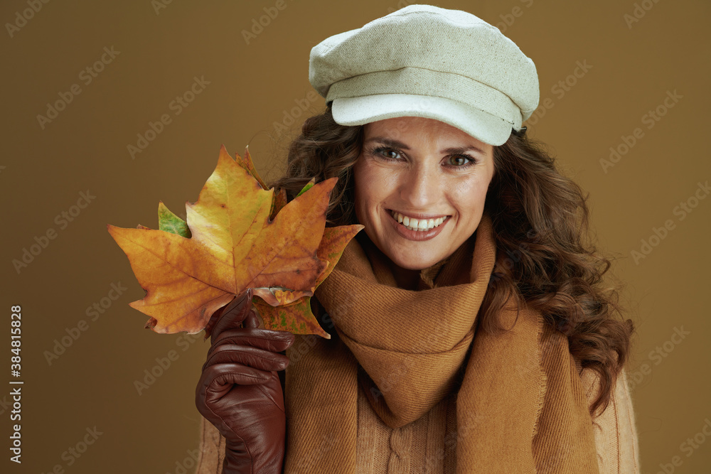 Portrait of smiling modern woman in sweater isolated on beige Portrait of smiling modern woman in sweater isolated on beige