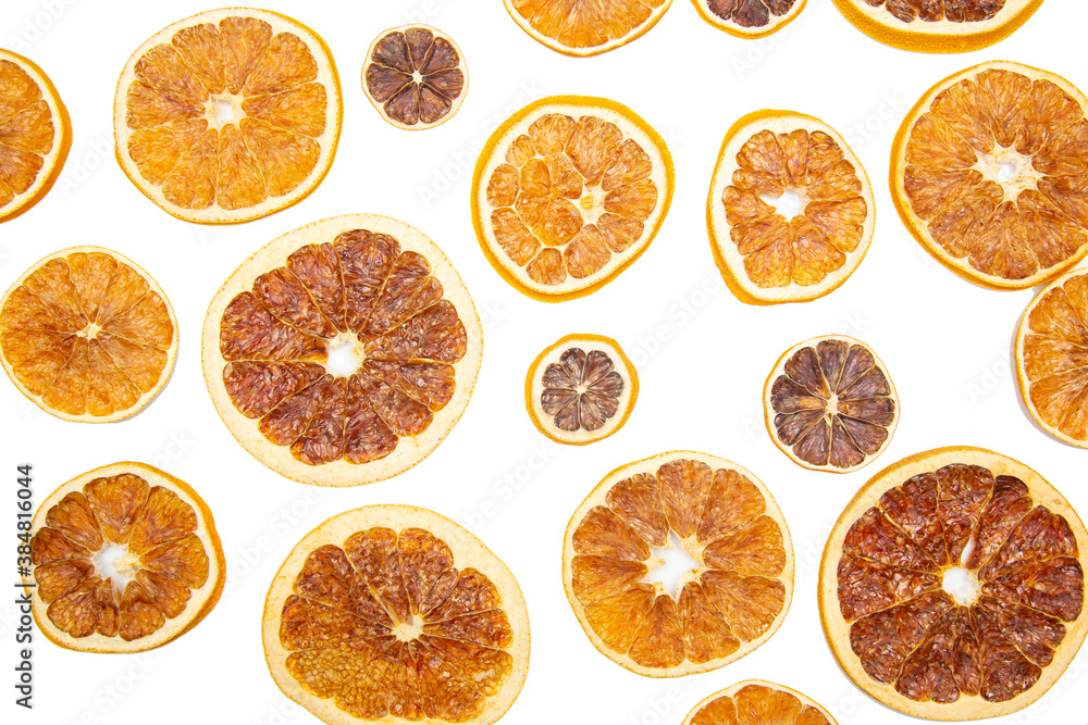 Dried slices of various citrus fruits on white background