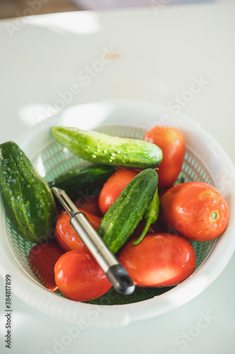 vegetables in a plastic container. cucumber and tomato