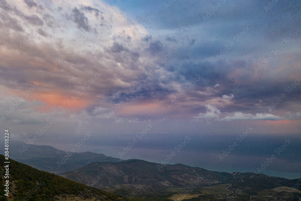 beautiful mountains at sunset against the backdrop of storm clouds beautiful mountains at sunset against the backdrop of storm clouds