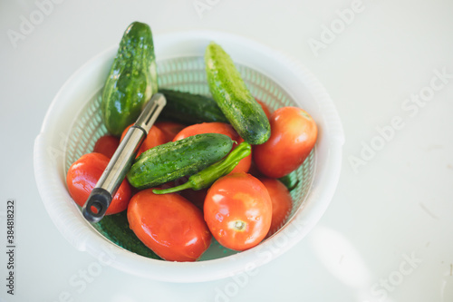 vegetables in a plastic container. cucumber and tomato