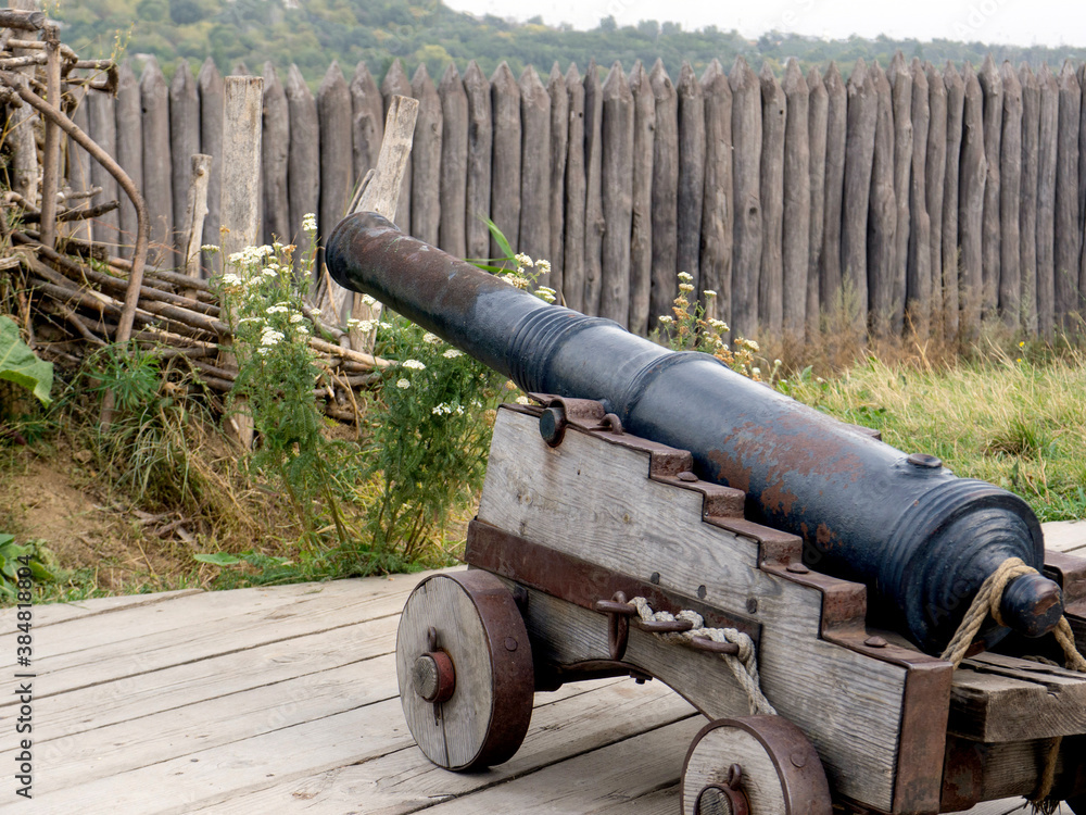 Ancient weapons. Cannon. Small wooden wheels.