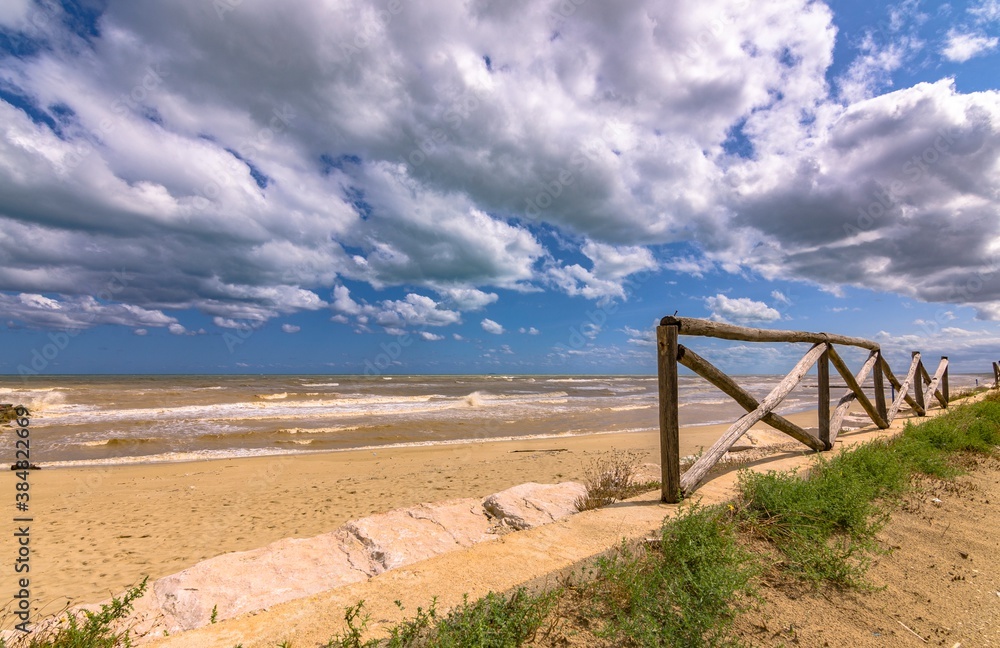 Fototapeta premium Seascape - Footpath with fence and cloudy sky