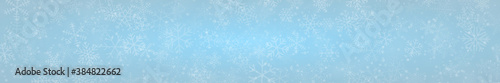 Christmas banner of snowflakes of different shapes  sizes and transparency on light blue background