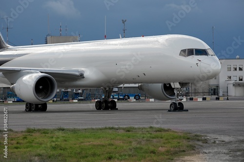 Cargo airplane parked at an airport, blank white body