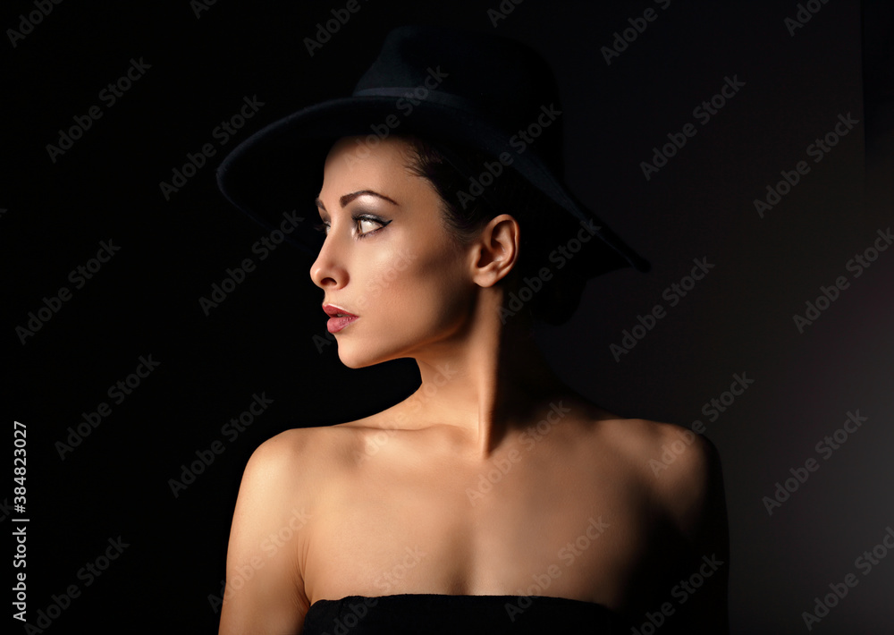 Beautiful makeup woman with elegant healthy neck, nude back and shoulder on black background in fashion hat with empty copy space. Closeup profile view portrait. Art. Beautiful makeup woman with elegant healthy neck, nude back and shoulder on black background in fashion hat with empty copy space. Closeup profile view portrait. Art.