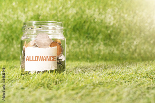 Photos allowance money, coins in glass jar for money saving financial c