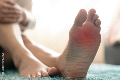 Quadro su tela foot ankle injury pain women touch her foot painful, healthcare