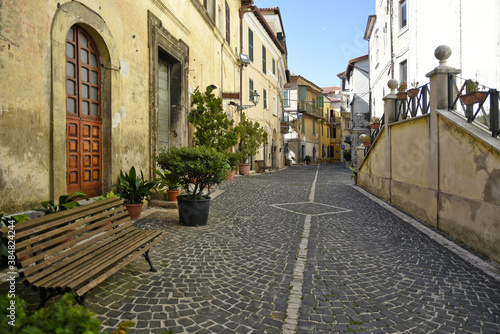 Fototapeta Naklejka Na Ścianę i Meble -  A narrow street among the old houses of Fiuggi, a medieval village in the Lazio region.