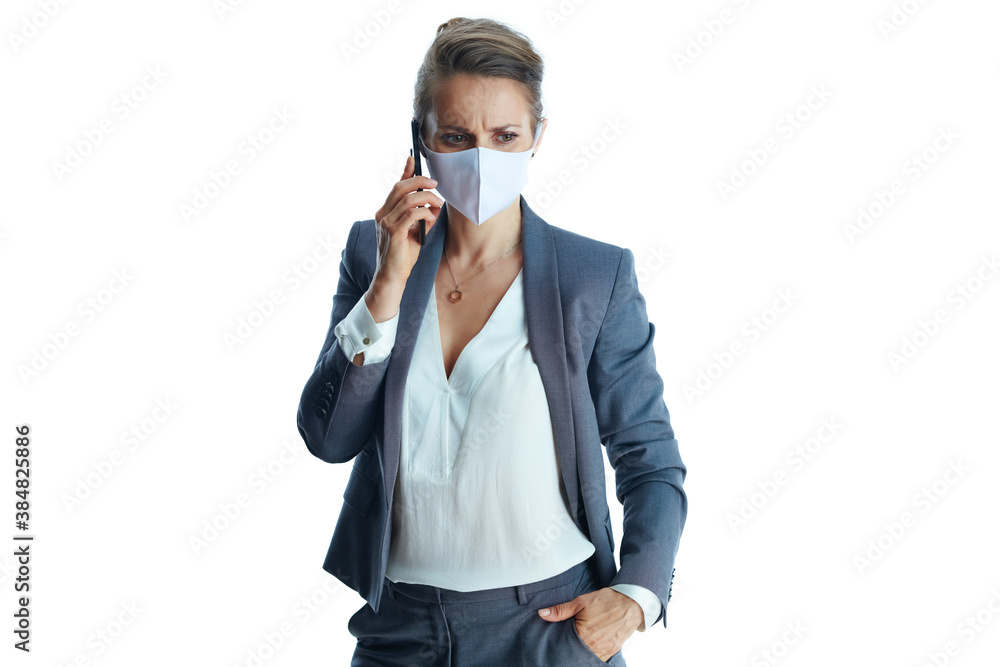 elegant female in grey suit on white talking on smartphone elegant female in grey suit on white talking on smartphone