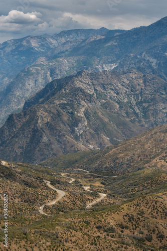 A view of the famous Kings Canyon 50-mile Byway and mountains within Kings Canyon National Park, California. A long twisting and turning road.