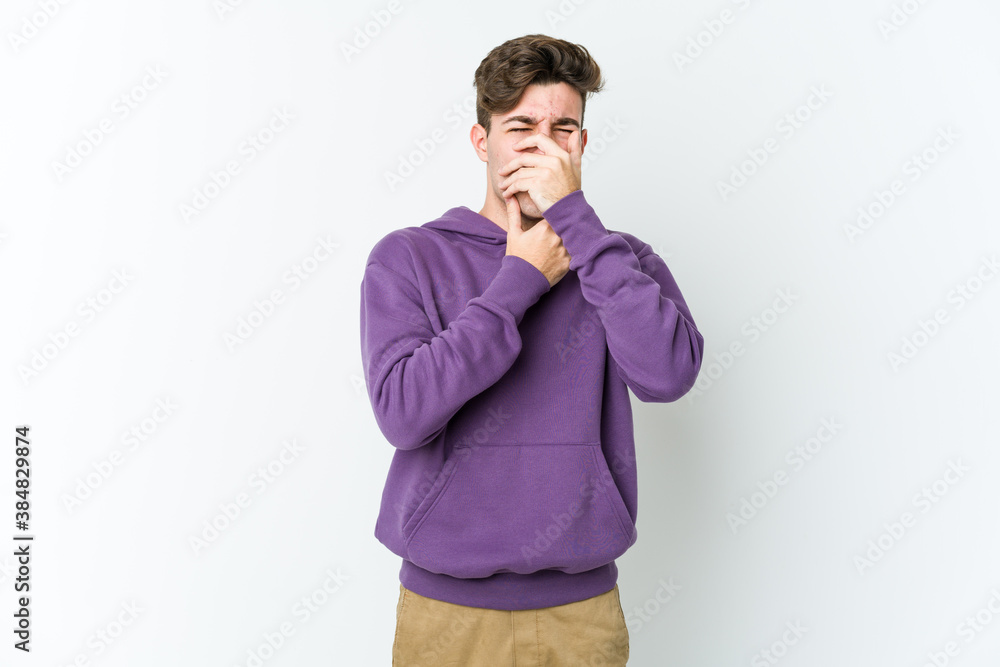 Young caucasian man isolated on white background suffers pain in throat due a virus or infection. Young caucasian man isolated on white background suffers pain in throat due a virus or infection.