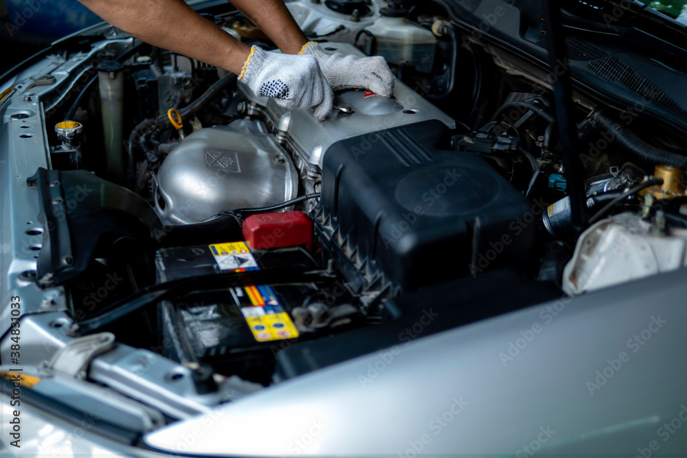 Auto mechanic working in garage. Repair service. Auto mechanic working in garage. Repair service.