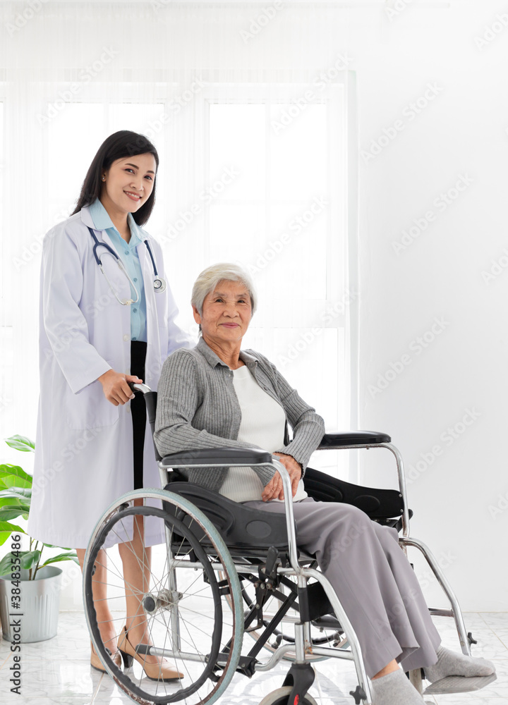 Asian health worker drive a wheelchair of old patient, doctor and old female talk about disease symptoms and treatment plan, happy hospital, rehabilitation activity, elderly healthcare promotion Asian health worker drive a wheelchair of old patient, doctor and old female talk about disease symptoms and treatment plan, happy hospital, rehabilitation activity, elderly healthcare promotion