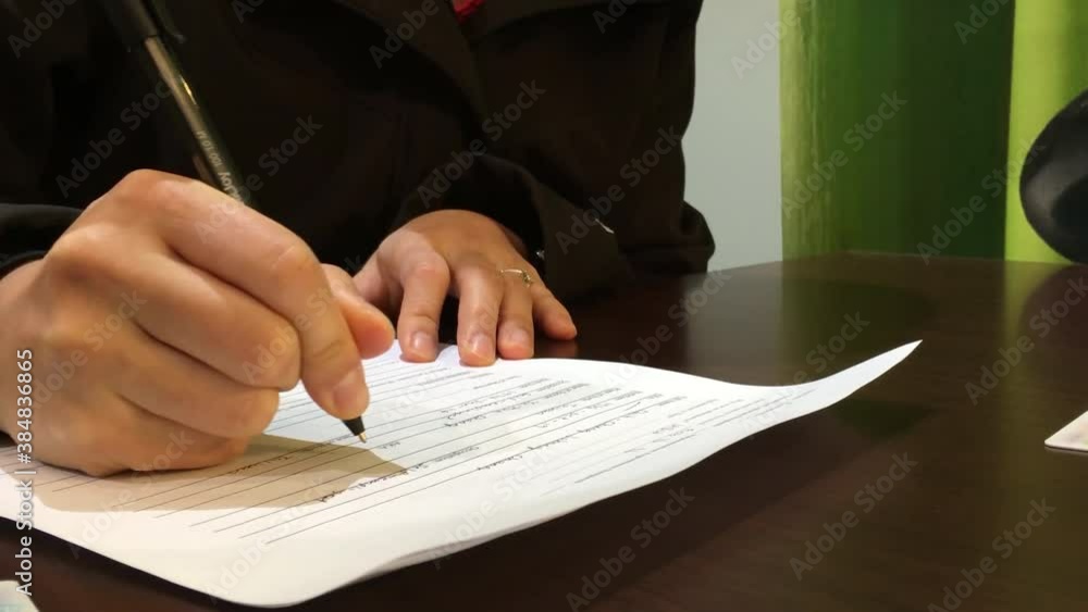 People filling the application form for applying for a passport with 4k resolution People filling the application form for applying for a passport with 4k resolution