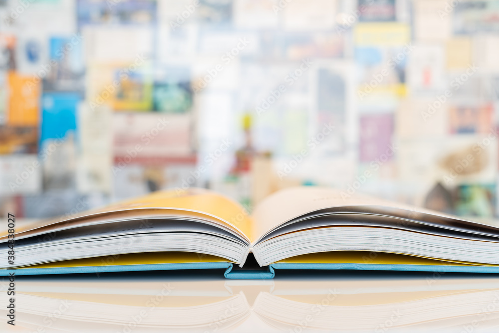 An open book with soft pastel blurred background An open book with soft pastel blurred background