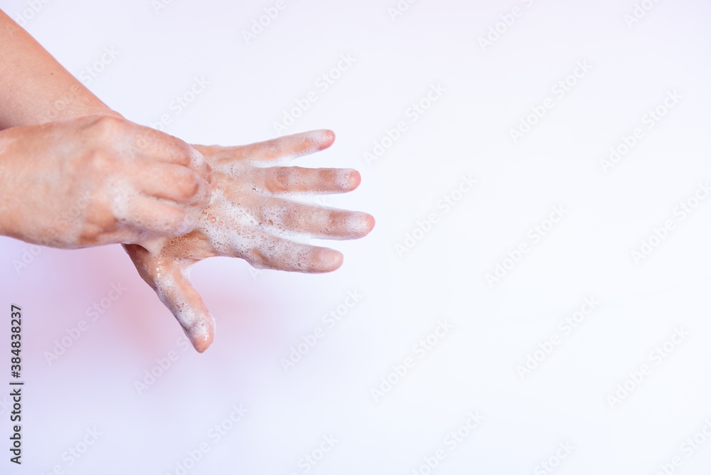 Prevent coronavirus or COVID-19 concept. Handwashing of cleaning hand wash with bubble liquid soap at sink. Prevent coronavirus or COVID-19 concept. Handwashing of cleaning hand wash with bubble liquid soap at sink.