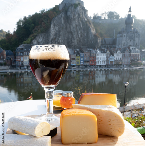 Obraz na plátně Glass of Belgian abbey beer and tasting of cheeses made with trappist beer and f