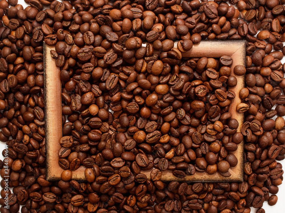 Wooden brown frame on coffee beans background. Concept of coffee drink time. Wooden brown frame on coffee beans background. Concept of coffee drink time.