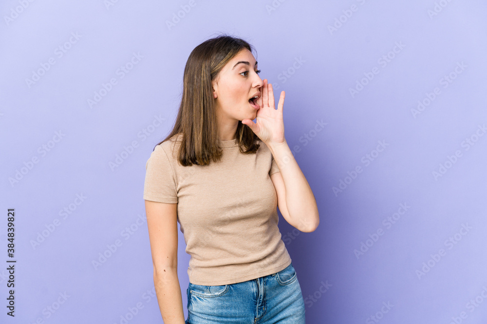 Young caucasian woman is saying a secret hot braking news and looking aside Young caucasian woman is saying a secret hot braking news and looking aside