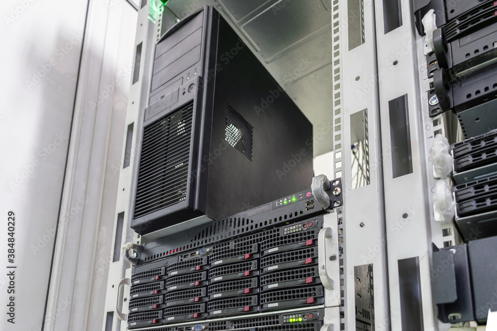 There is a large server computer system unit in the data center rack. Data center computing equipment. Hosting platform of the Internet provider. There is a large server computer system unit in the data center rack. Data center computing equipment. Hosting platform of the Internet provider.