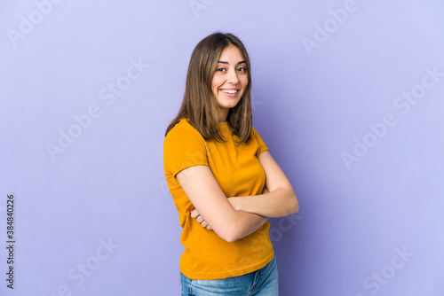 Young caucasian woman who feels confident, crossing arms with determination.