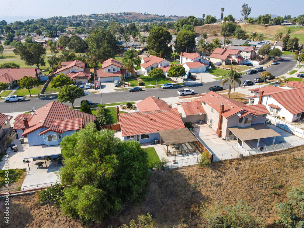 Aerial view of Southern California houses in inland town Corona, during hot summer. USA