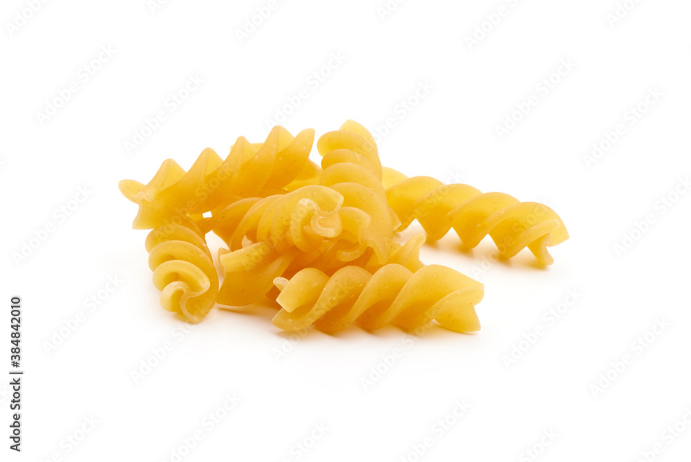 Raw fusilli pasta, close-up, isolated on white background Raw fusilli pasta, close-up, isolated on white background