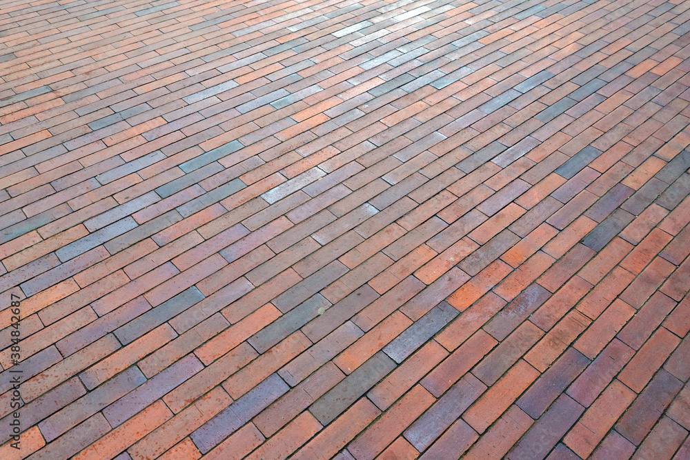 High quality red pavement from ceramic clinker brick tiles. Sidewalk made of expensive and high quality materials. Selective focus.