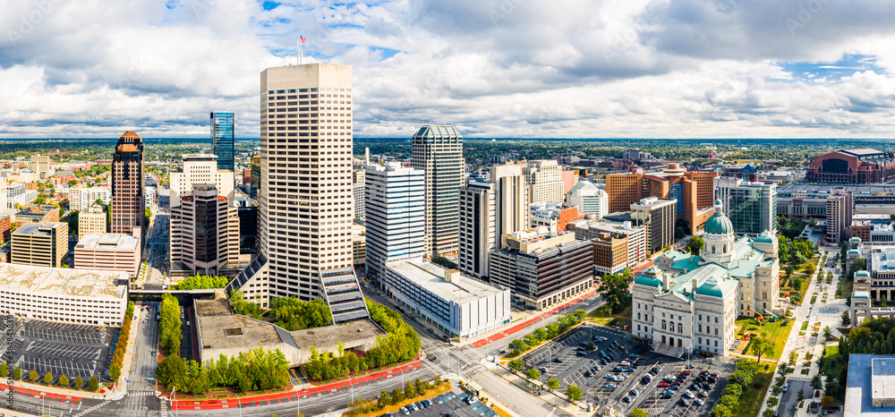 Drone view of the Indiana Statehouse and Indianapolis skyline on a late afternoon. Indianapolis is the state capital and most-populous city of the U.S. state of Indiana and the seat of Marion County.