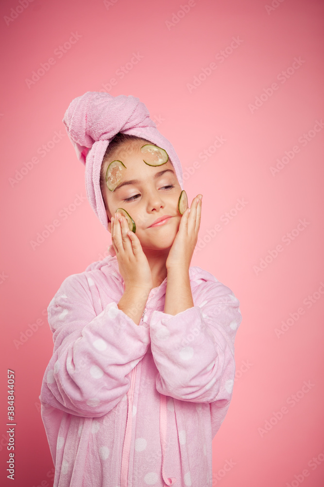 girl in a terry dressing gown and with a towel wrapped around her head girl in a terry dressing gown and with a towel wrapped around her head