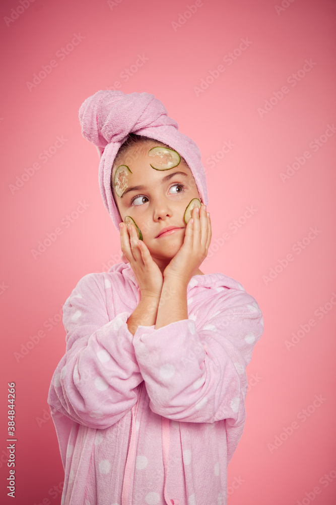 girl in a terry dressing gown and with a towel wrapped around her head girl in a terry dressing gown and with a towel wrapped around her head
