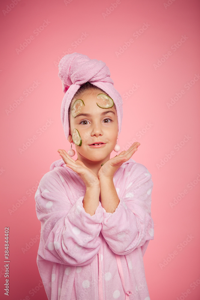 girl in a terry dressing gown and with a towel wrapped around her head girl in a terry dressing gown and with a towel wrapped around her head