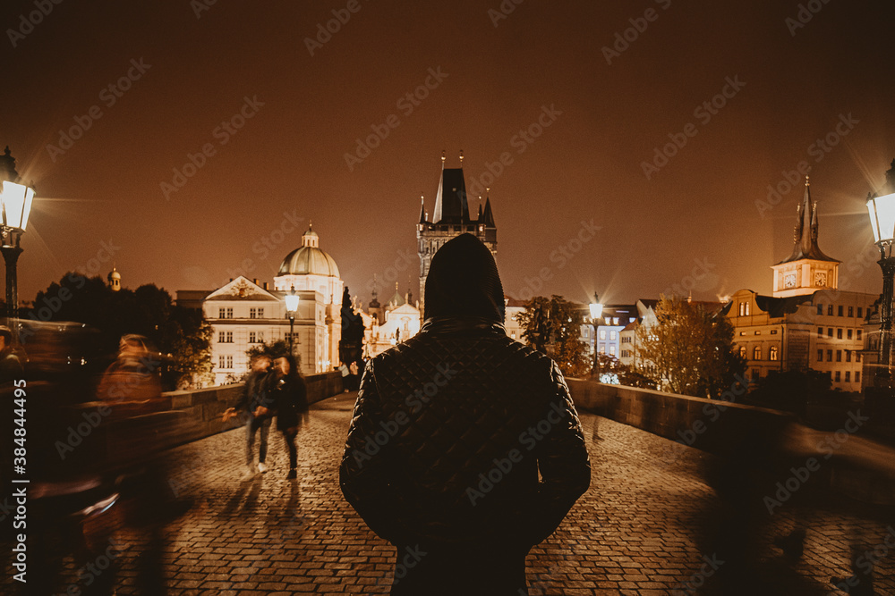Man Standing on Charles Bridge in Prague