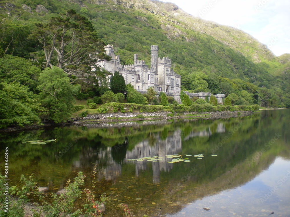 Irish landscape with Kylemore Abbey and water reflection
