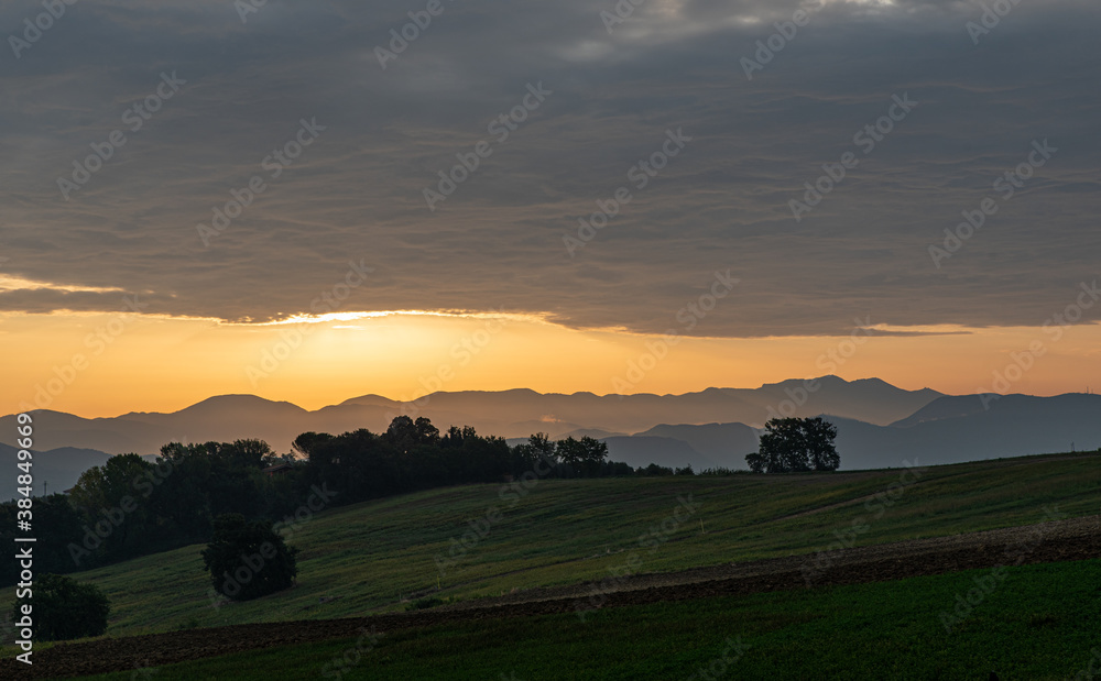 Orange sunrise on the countryside. Concept of peace and serenity Orange sunrise on the countryside. Concept of peace and serenity
